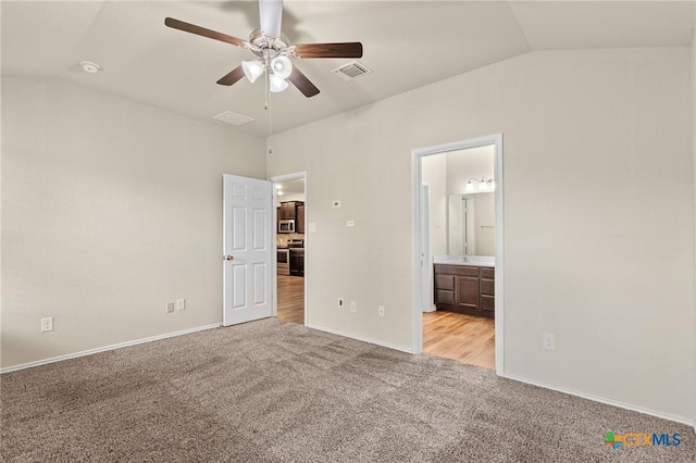 206 Danielle Dr, Killeen, TX 76542 - unfurnished bedroom with vaulted ceiling, light carpet, ensuite bathroom, and a ceiling fan