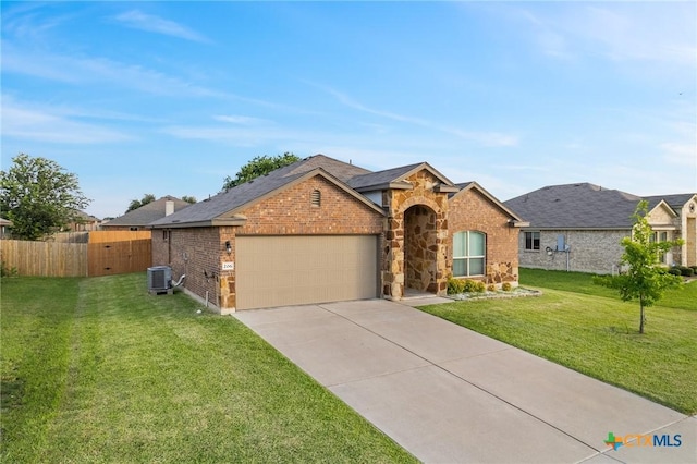206 Danielle Dr, Killeen, TX 76542 - view of front of house with a garage, concrete driveway, brick siding, and stone siding
