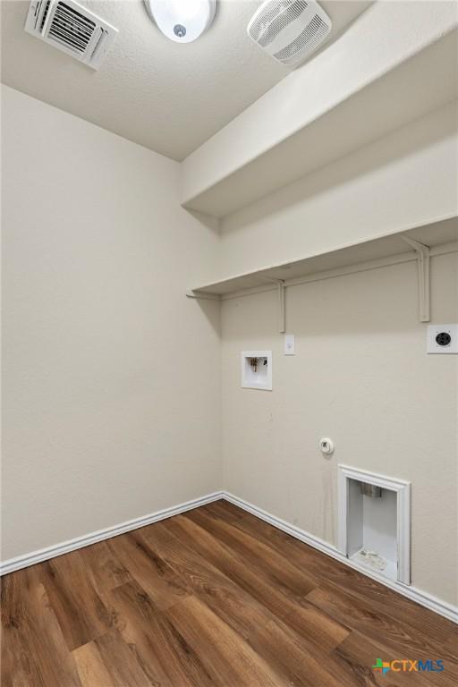 206 Danielle Dr, Killeen, TX 76542 - laundry area featuring washer hookup, hookup for an electric dryer, wood finished floors, and gas dryer hookup