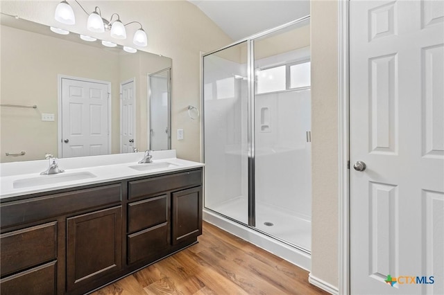 206 Danielle Dr, Killeen, TX 76542 - full bathroom with a stall shower, wood finished floors, and double vanity