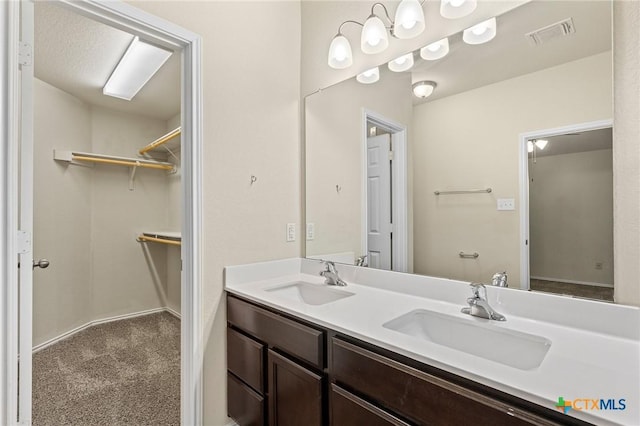 206 Danielle Dr, Killeen, TX 76542 - bathroom featuring double vanity and a spacious closet