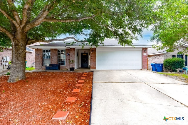 single story home with a garage and a porch