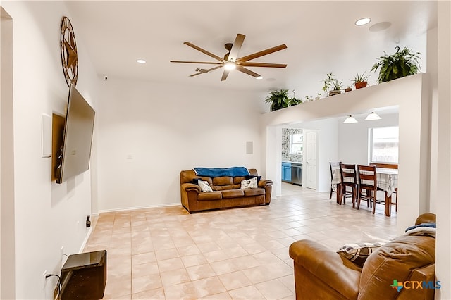 tiled living room with ceiling fan