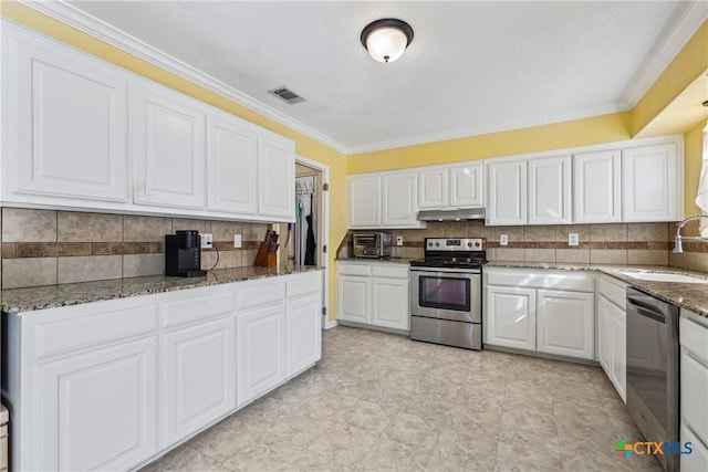 kitchen featuring under cabinet range hood, a sink, white cabinetry, visible vents, and appliances with stainless steel finishes