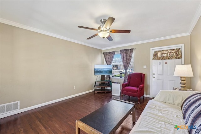 living area featuring visible vents, crown molding, baseboards, and wood finished floors