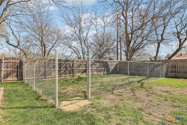 view of yard with a fenced backyard