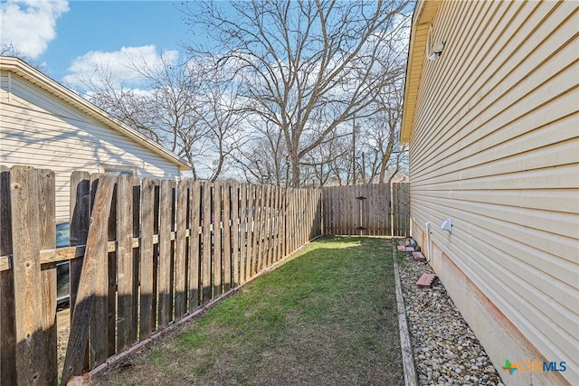 view of yard featuring a fenced backyard