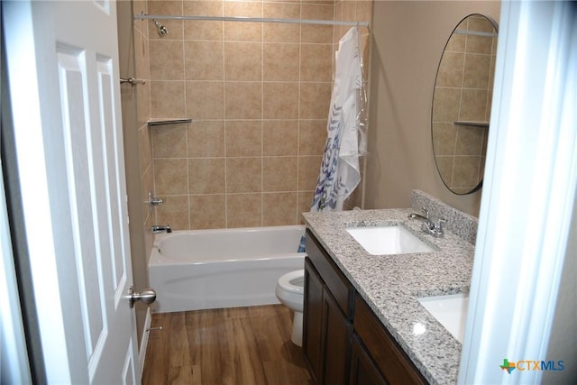 1204 N 18th St, Killeen, TX 76541 - bathroom featuring shower / bath combination with curtain, toilet, vanity, and wood finished floors
