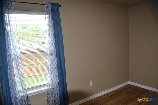 1204 N 18th St, Killeen, TX 76541 - unfurnished room featuring dark wood finished floors and baseboards