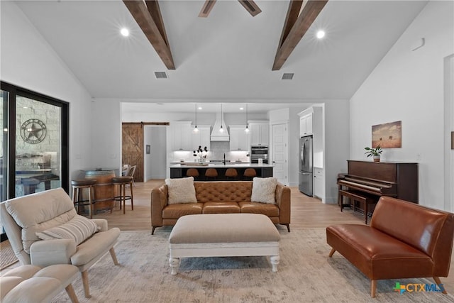 1306 Crystal Spgs, Salado, TX 76571 - living area featuring a barn door, light wood-type flooring, ceiling fan, and recessed lighting