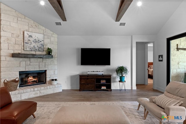 1306 Crystal Spgs, Salado, TX 76571 - living area with wood finished floors, a stone fireplace, and baseboards