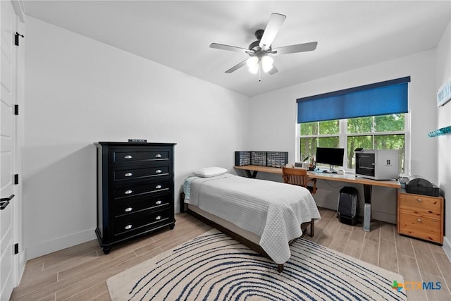 1306 Crystal Spgs, Salado, TX 76571 - bedroom featuring wood tiled floors, a desk, baseboards, and ceiling fan