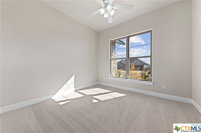 empty room featuring carpet flooring and ceiling fan