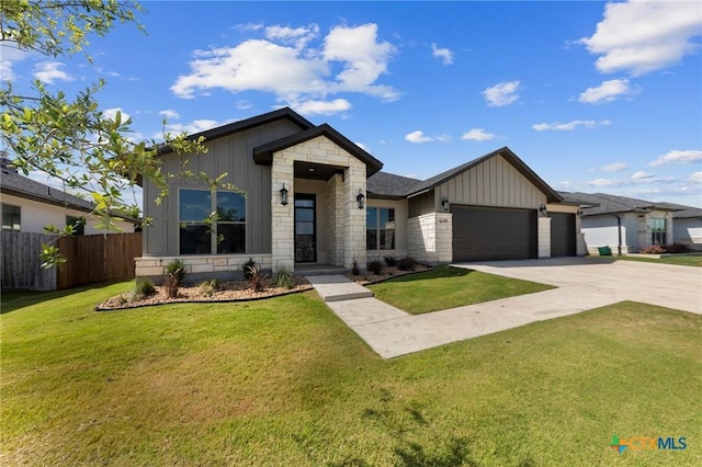 view of front facade with a front yard and a garage