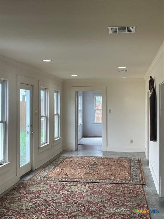 doorway featuring ornamental molding