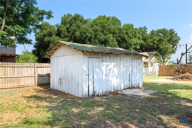 view of outbuilding featuring a yard