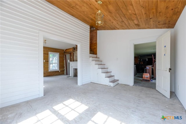 interior space featuring lofted ceiling and wood ceiling