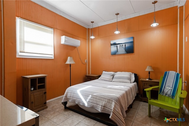 tiled bedroom featuring a wall mounted air conditioner