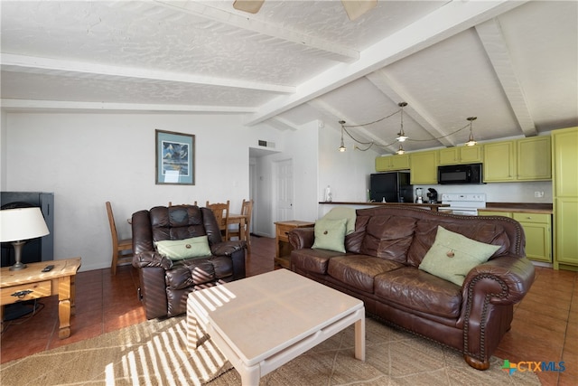 living room with tile patterned flooring, lofted ceiling with beams, and a textured ceiling