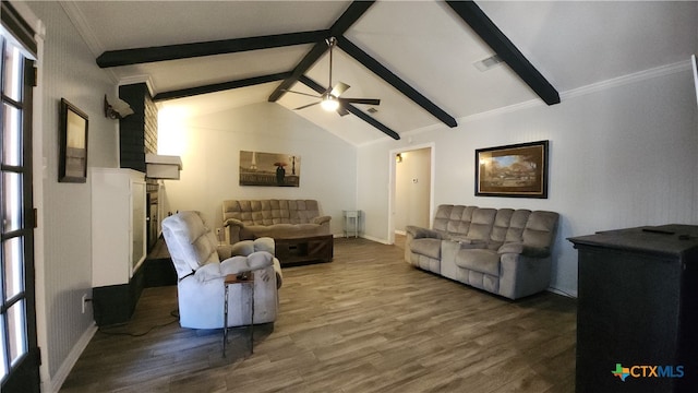 living room featuring dark hardwood / wood-style flooring, vaulted ceiling with beams, crown molding, and ceiling fan