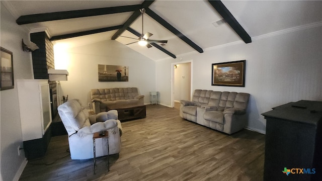 living room with vaulted ceiling with beams, hardwood / wood-style floors, ceiling fan, crown molding, and a large fireplace