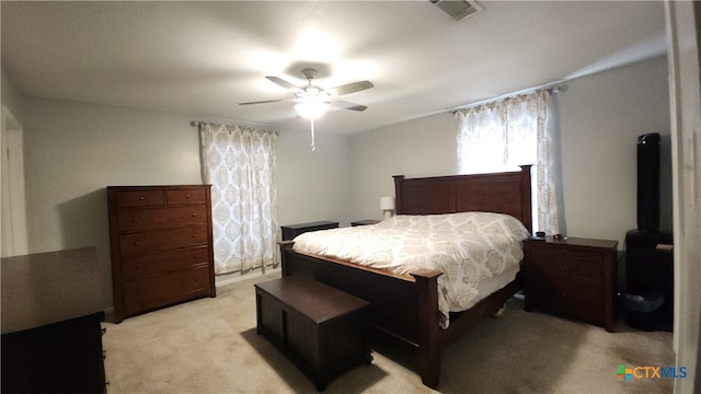 bedroom featuring light carpet and ceiling fan