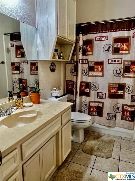 4305 Foster Ln, Killeen, TX 76549 - full bathroom with vanity, toilet, and tile patterned flooring