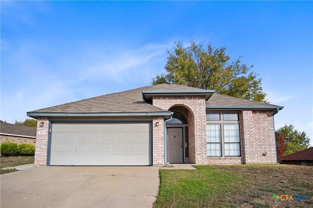 view of front of property with a garage