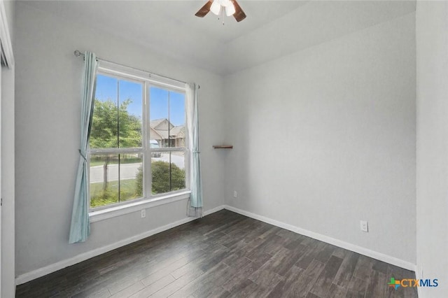 3542 Hurricane Trl, New Braunfels, TX 78130 - unfurnished room with plenty of natural light, dark wood finished floors, and ceiling fan