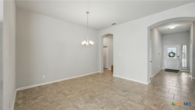 3542 Hurricane Trl, New Braunfels, TX 78130 - unfurnished dining area featuring a chandelier, arched walkways, and baseboards