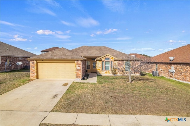 ranch-style home featuring a garage, central AC unit, and a front lawn