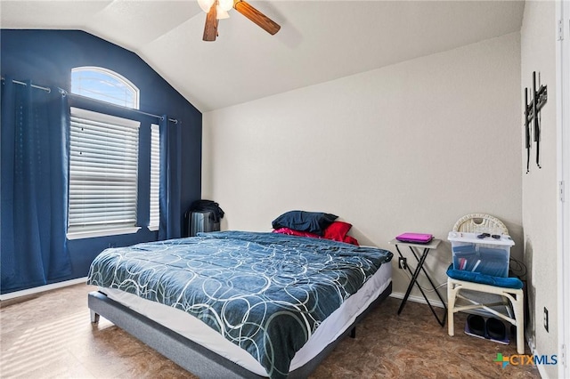 bedroom with lofted ceiling and ceiling fan