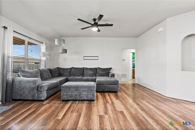 living room with ceiling fan and hardwood / wood-style floors