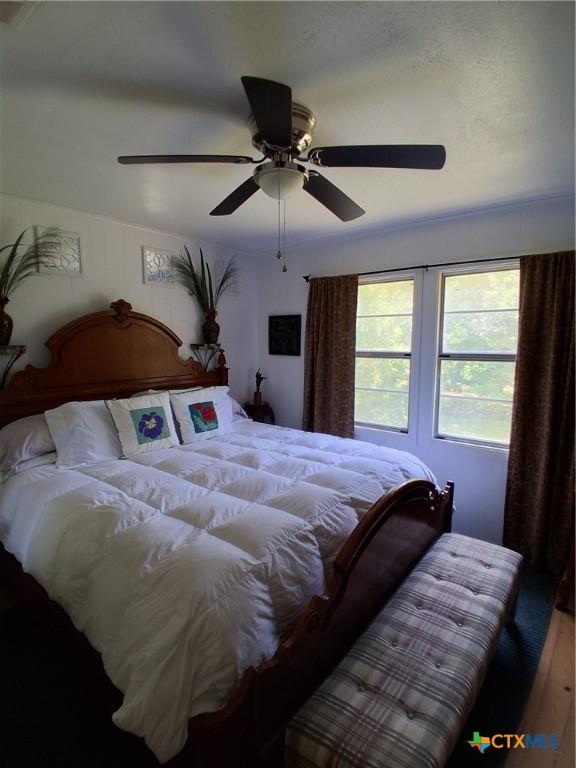 1837 Colleen Dr, Canyon Lake, TX 78133 - bedroom with ceiling fan and wood finished floors