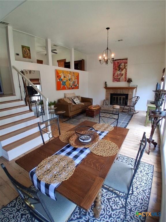 1837 Colleen Dr, Canyon Lake, TX 78133 - dining space featuring hardwood / wood-style floors, stairway, and a chandelier