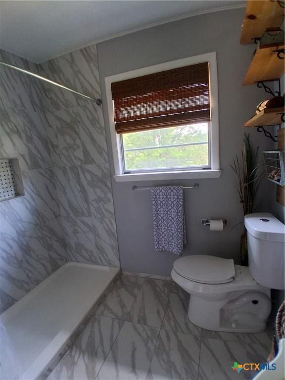 1837 Colleen Dr, Canyon Lake, TX 78133 - bathroom featuring toilet, a tile shower, and marble look tiles