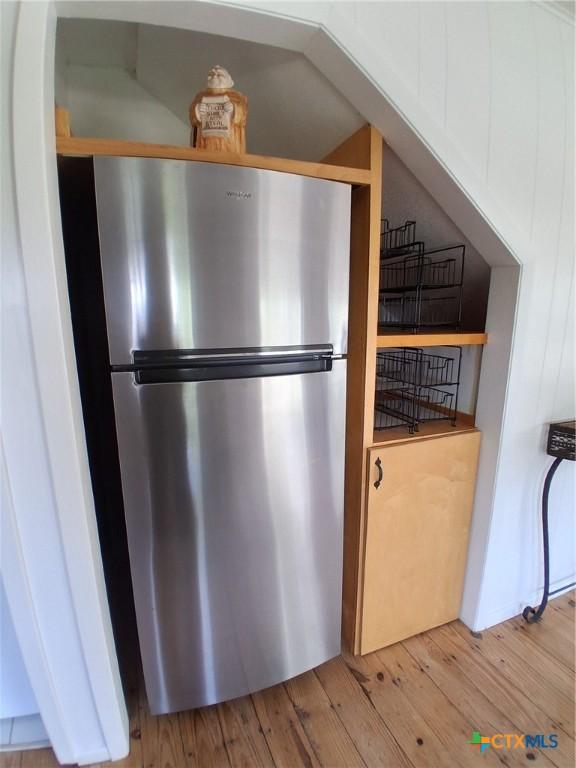 1837 Colleen Dr, Canyon Lake, TX 78133 - detailed view of freestanding refrigerator and light wood-style flooring