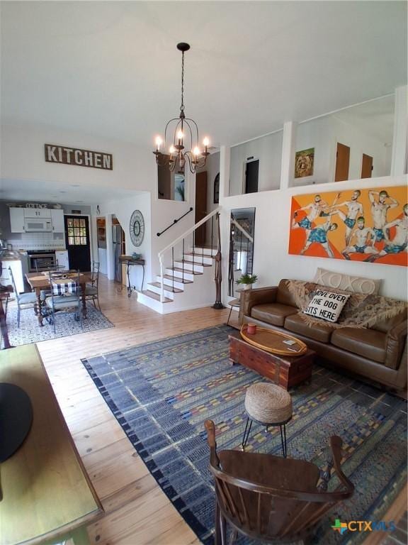 1837 Colleen Dr, Canyon Lake, TX 78133 - living area featuring stairway, a chandelier, and wood finished floors