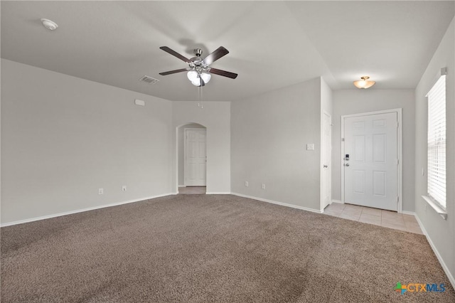 2048 Wigeon Way, Copperas Cove, TX 76522 - unfurnished room with light colored carpet, arched walkways, a ceiling fan, and plenty of natural light