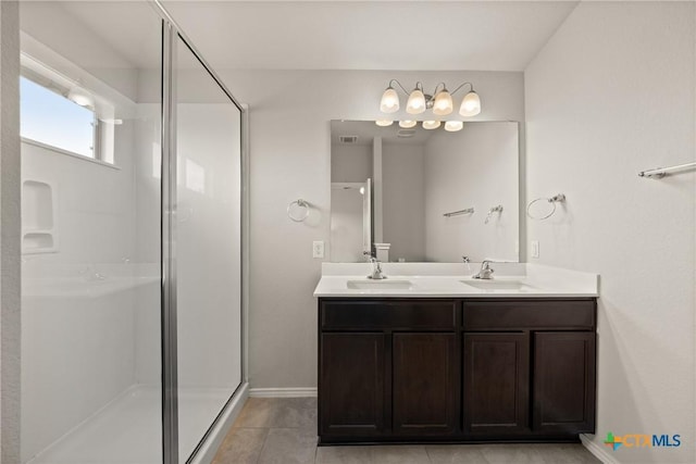2048 Wigeon Way, Copperas Cove, TX 76522 - bathroom featuring double vanity, a stall shower, and tile patterned floors