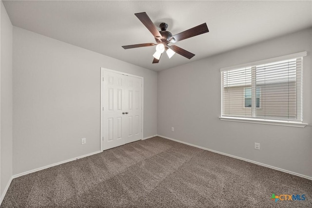 2048 Wigeon Way, Copperas Cove, TX 76522 - unfurnished bedroom featuring dark colored carpet, a closet, and ceiling fan