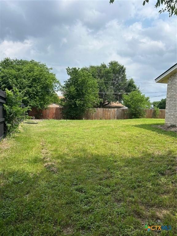 view of yard featuring fence