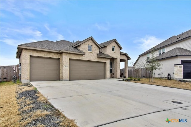 view of front of property with a garage