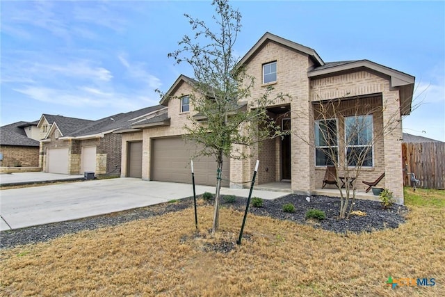 view of front of property with a garage and a front yard