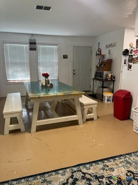 509 N St, Yoakum, TX 77995 - dining space with visible vents and finished concrete floors