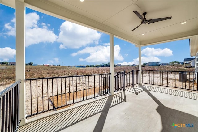 balcony with ceiling fan and a rural view