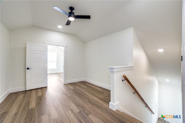 bonus room featuring ceiling fan, wood-type flooring, and lofted ceiling