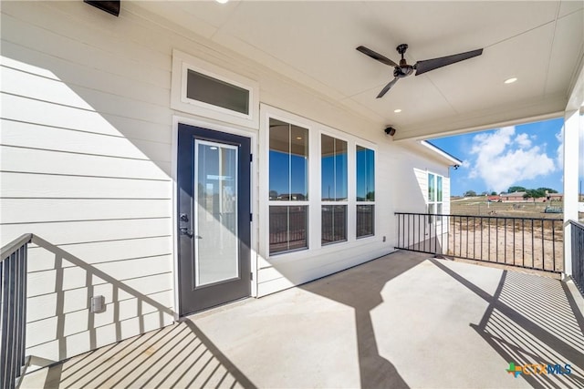 view of patio featuring ceiling fan