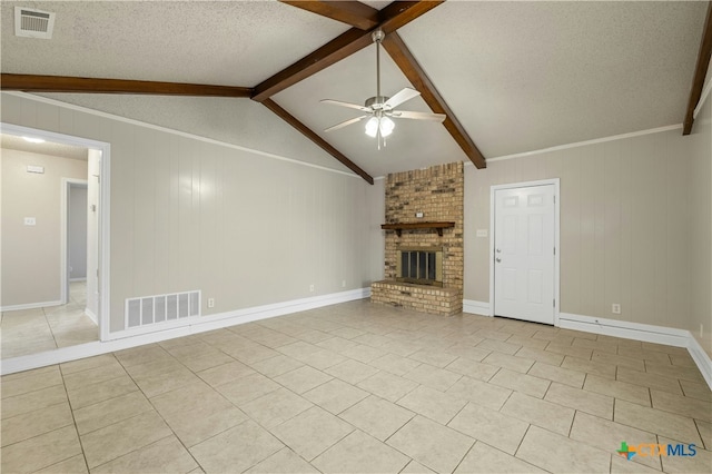 unfurnished living room featuring light tile patterned floors, a brick fireplace, ceiling fan, vaulted ceiling with beams, and a textured ceiling