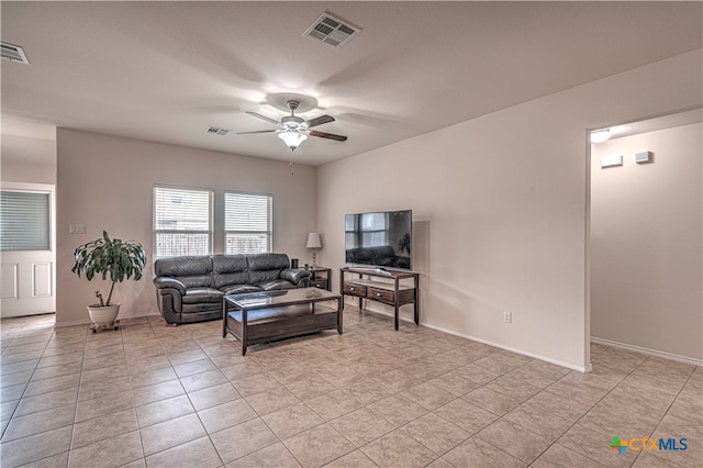 living room featuring light tile patterned flooring and ceiling fan